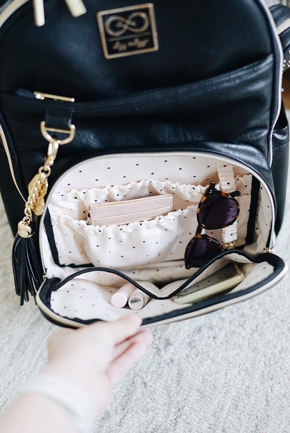 image:imageChelsea Cole For Itzy Ritzy Diaper Bag Backpack Large Capacity Boss Backpack Diaper Bag Includes Changing Pad Stroller Clips and Tassel Camo with Stag Head Print Interior and Black HardwareBlack With Gold Hardware