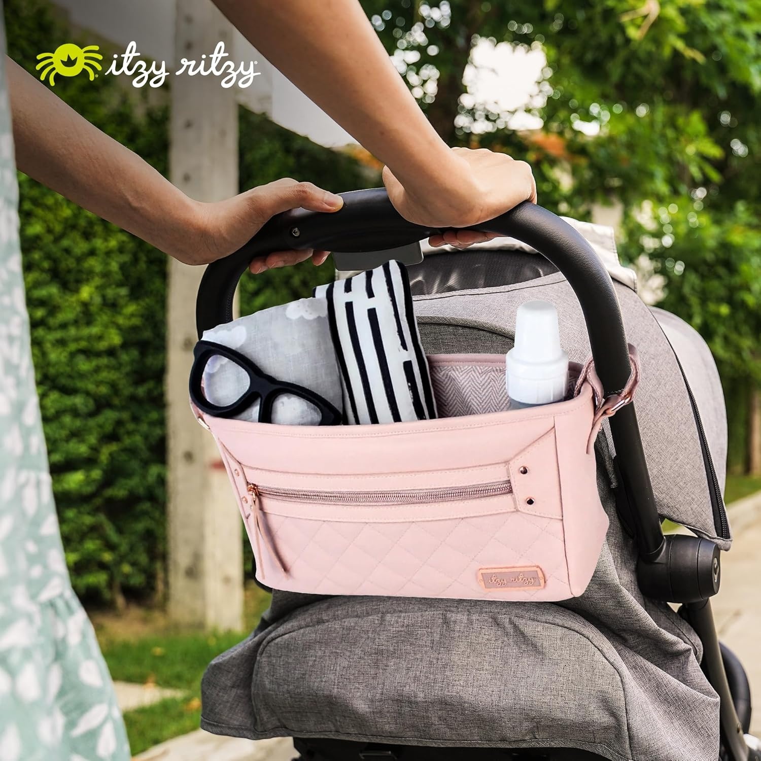 image:imageItzy Ritzy Adjustable Stroller CaddyOrganizer Stroller Organizer Bag Featuring Front Zippered Pocket 2 Builtin Interior Pockets amp Adjustable Straps to Fit Nearly Any Stroller Blush