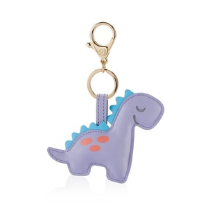 image:imageItzy Ritzy Diaper Bag Charm Purse Charm and Keychain Pouf Measures 4 in Diameter Features Durable Clasp and Trendy Gold Hardware Dark GrayLilac Dinosaur