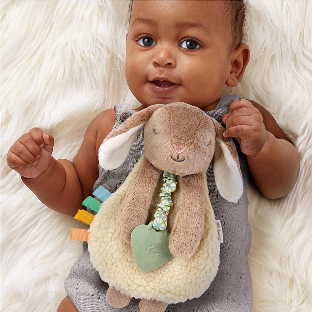 image:imageItzy Ritzy Itzy Lovey Including Teether Baby Lovey with Teether Textured Ribbons amp Dangle Arms Features Crinkle Sound Sherpa Fabric and Minky Plush BearTaupe Bunny