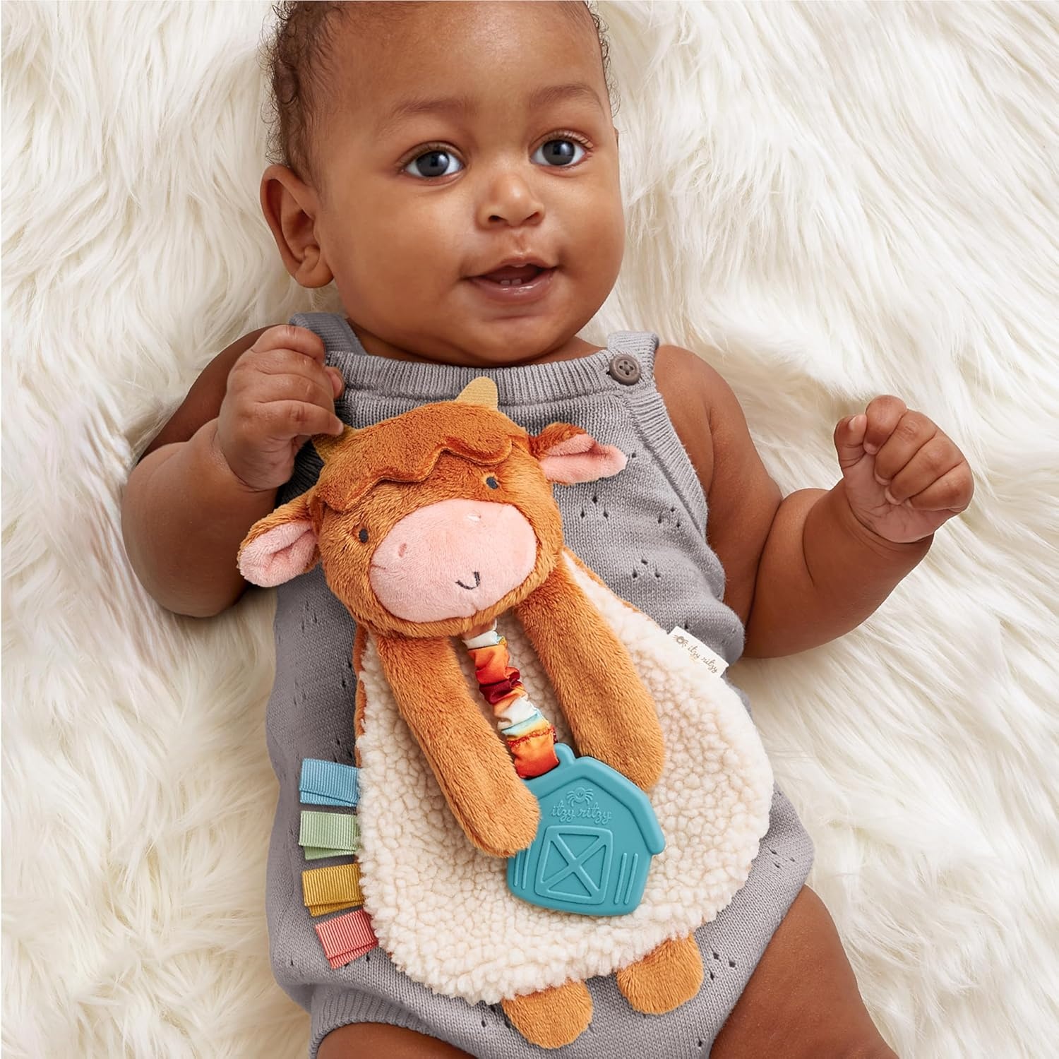 image:imageItzy Ritzy Itzy Lovey Including Teether Baby Lovey with Teether Textured Ribbons amp Dangle Arms Features Crinkle Sound Sherpa Fabric and Minky Plush BearHighland Cow