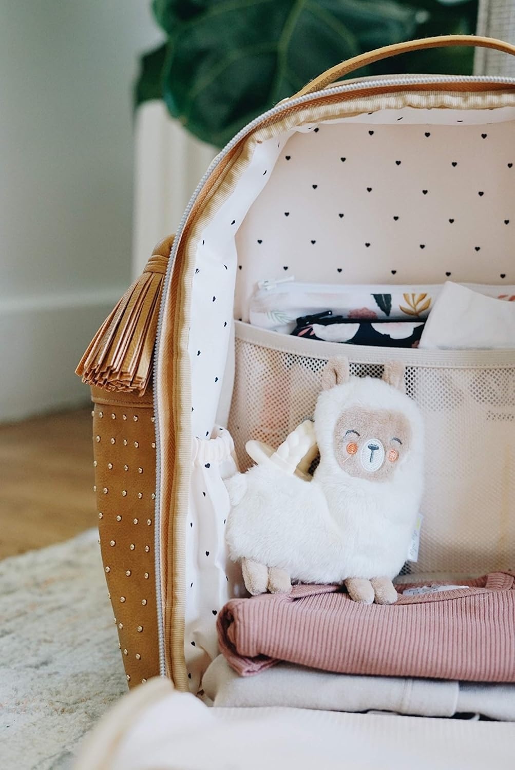 image:imageChelsea Cole for Itzy Ritzy Mini Diaper Bag Backpack Studded Mini Backpack with Changing Pad 8 Pockets Rubber Feet amp Tassel Caramel with Sweetheart Print Interior and Gold Hardware