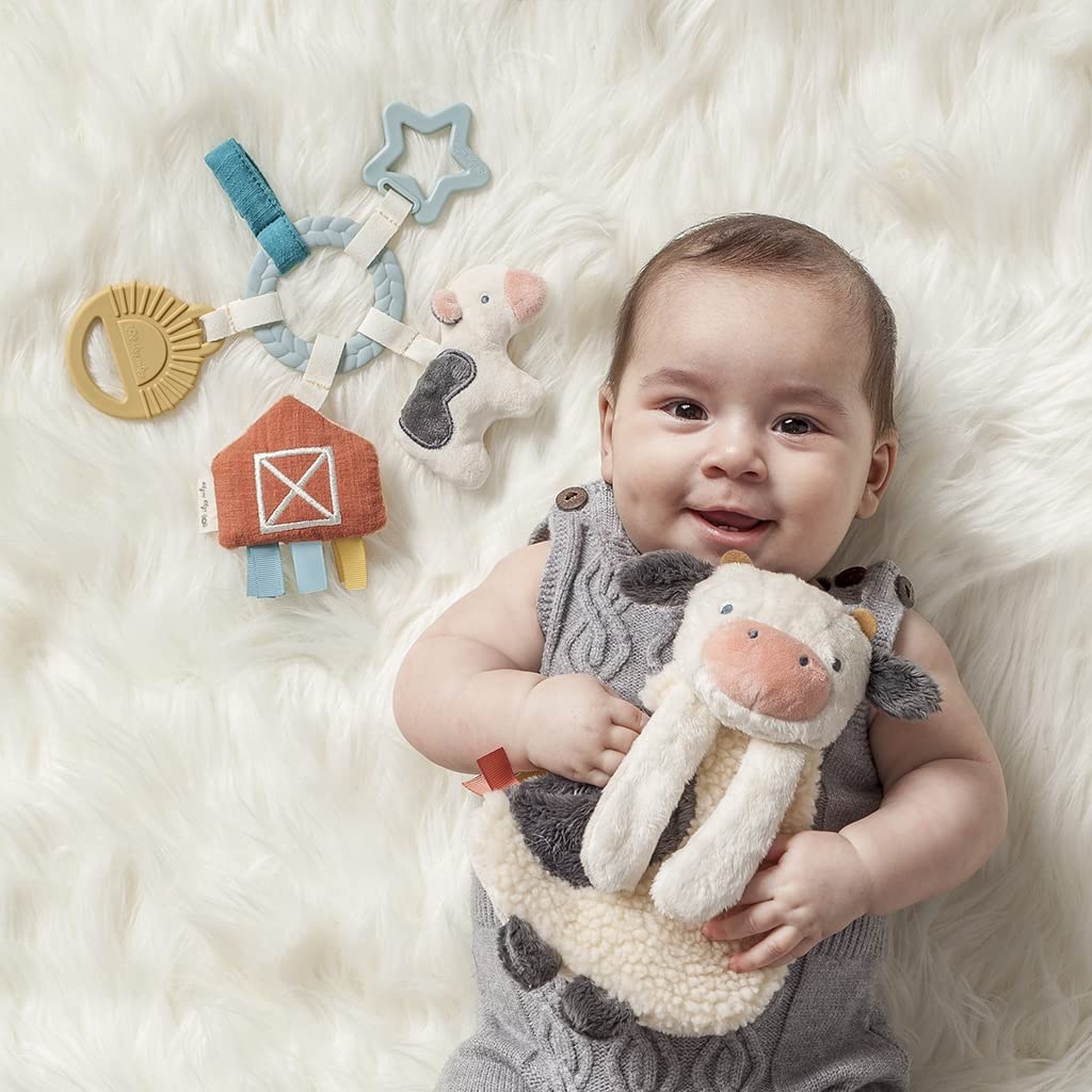 image:imageItzy Ritzy Teething Toy Gift Set Includes Cow Lovey amp BarnThemed Busy Ring Car Seat and Stroller Toy Features Crinkle Sounds Engaging Textures amp Silicone Teething Relief FarmFarm