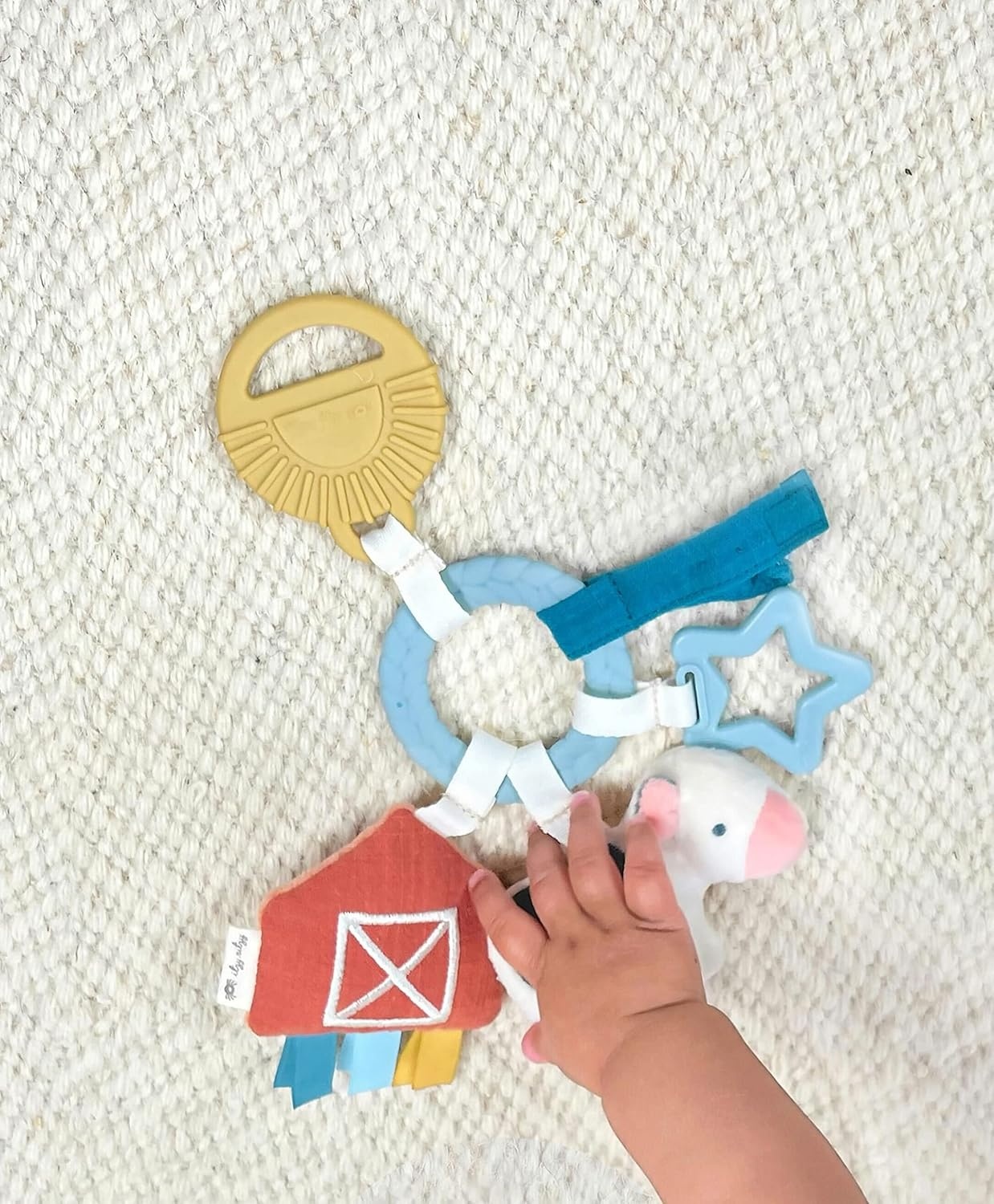 image:imageItzy Ritzy Teething Toy Gift Set Includes Cow Lovey amp BarnThemed Busy Ring Car Seat and Stroller Toy Features Crinkle Sounds Engaging Textures amp Silicone Teething Relief FarmFarm