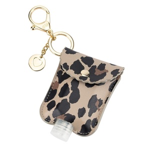 image:imageItzy Ritzy Hand Sanitizer Holder  Hand Sanitizer Case Keychain Fits 2Ounce Bottles of Sanitizers Not Included  Clips to Diaper Bag Purse or Travel Bag Leopard