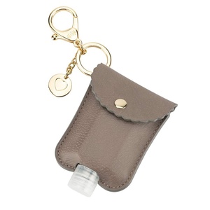 image:imageItzy Ritzy Hand Sanitizer Holder  Hand Sanitizer Case Keychain Fits 2Ounce Bottles of Sanitizers Not Included  Clips to Diaper Bag Purse or Travel Bag Taupe