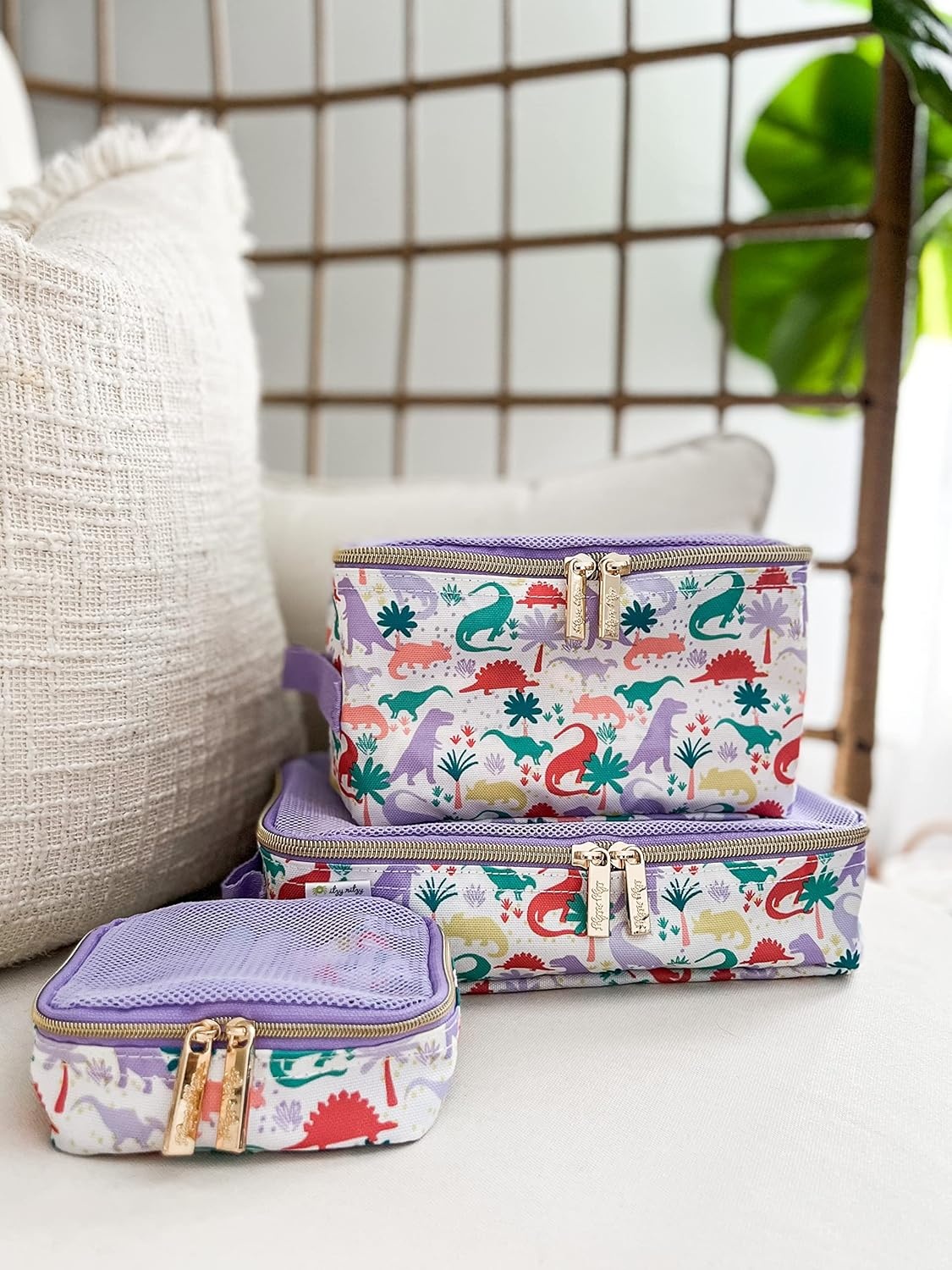 image:imageItzy Ritzy Packing Cubes For Travel Set of 3 Packing Cubes or Travel Organizers Each Cube Features a Mesh Top Double Zippers and a Fabric Handle Purple DinosaursPurple Dinosaurs