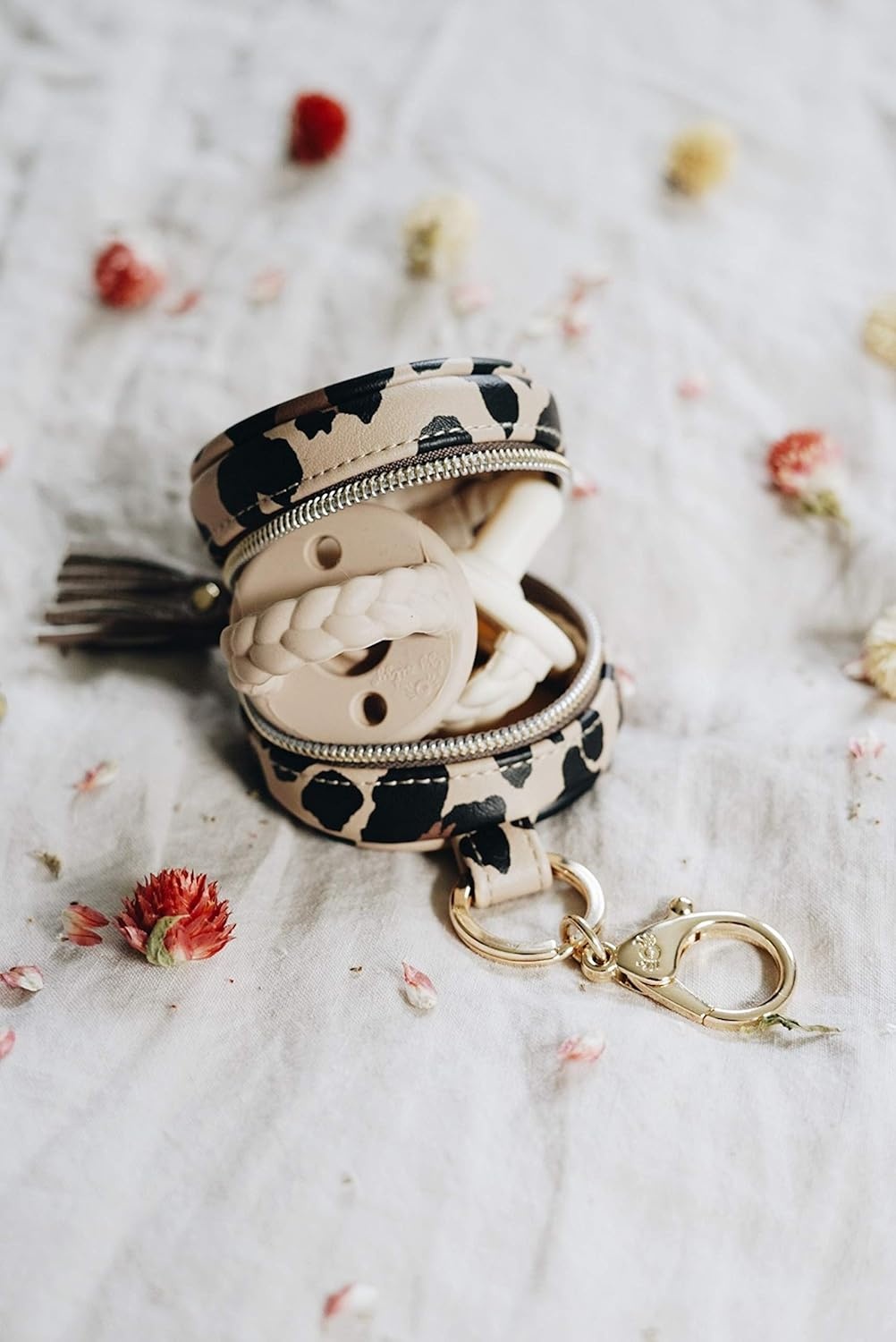 image:imageItzy Ritzy Pacifier Holder Case with Clip Pacifier Case Includes Clasp to Easily Attach to a Diaper Bag or Purse Measures 25 in Diameter and Holds 2 Pacifiers Milk amp HoneyLeopard