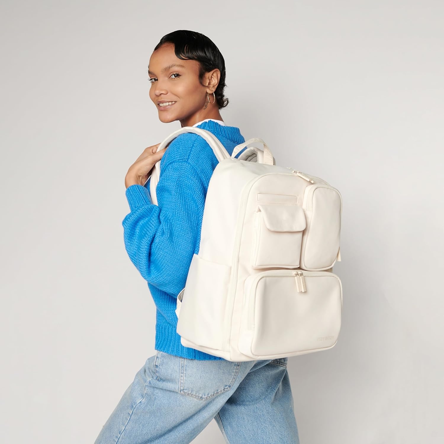 image:imageItzy Ritzy Utility Diaper Bag Backpack Features 17 Pockets Including 2 Insulated Bottle Holders amp Trolley Sleeve and Includes Stroller Straps amp Changing Pad Part of the Belong Collection GreenCream