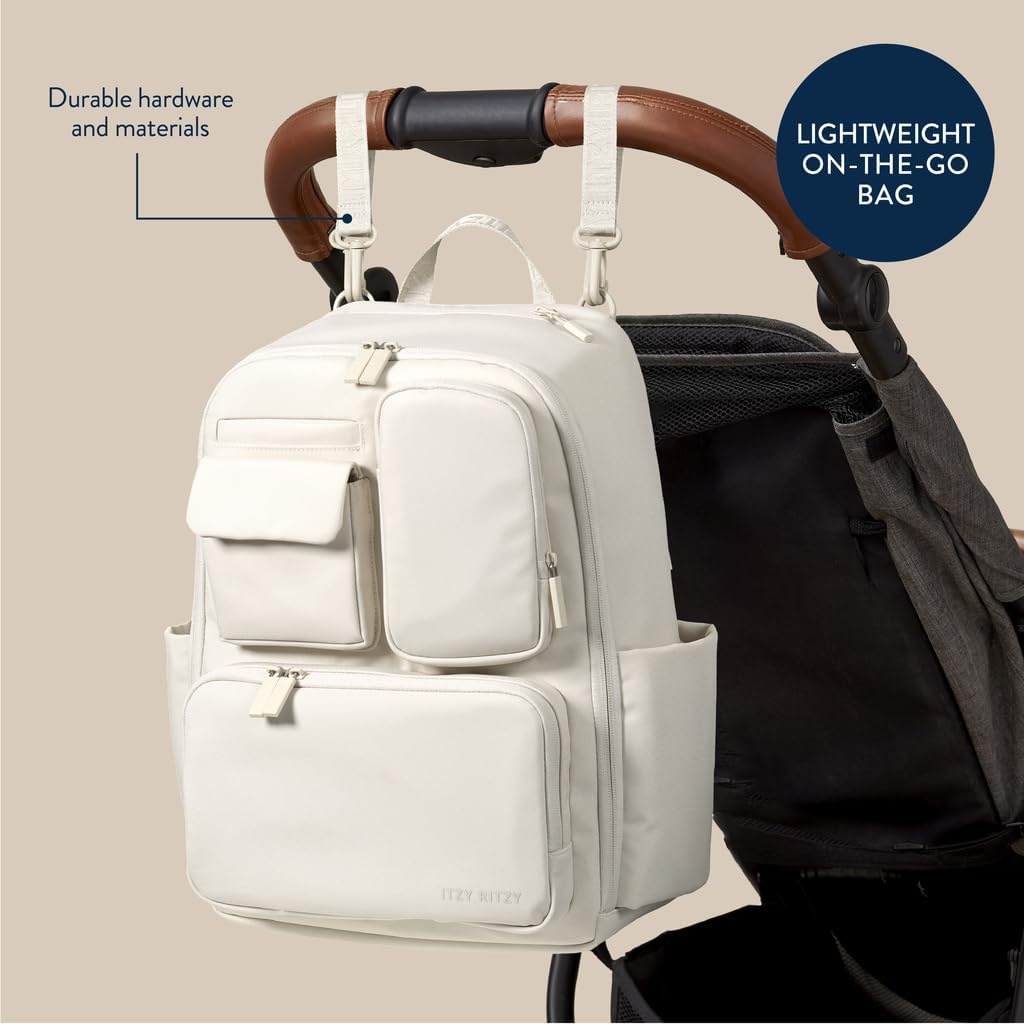 image:imageItzy Ritzy Utility Diaper Bag Backpack Features 17 Pockets Including 2 Insulated Bottle Holders amp Trolley Sleeve and Includes Stroller Straps amp Changing Pad Part of the Belong Collection GreenCream