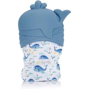 image:imageItzy Ritzy Silicone Teething Mitt  Soothing Infant Teething Mitten with Adjustable Strap Crinkle Sound amp Textured Silicone to Soothe Sore amp Swollen Gums  for Ages 3 Months amp Up Teal DinosaurWhale