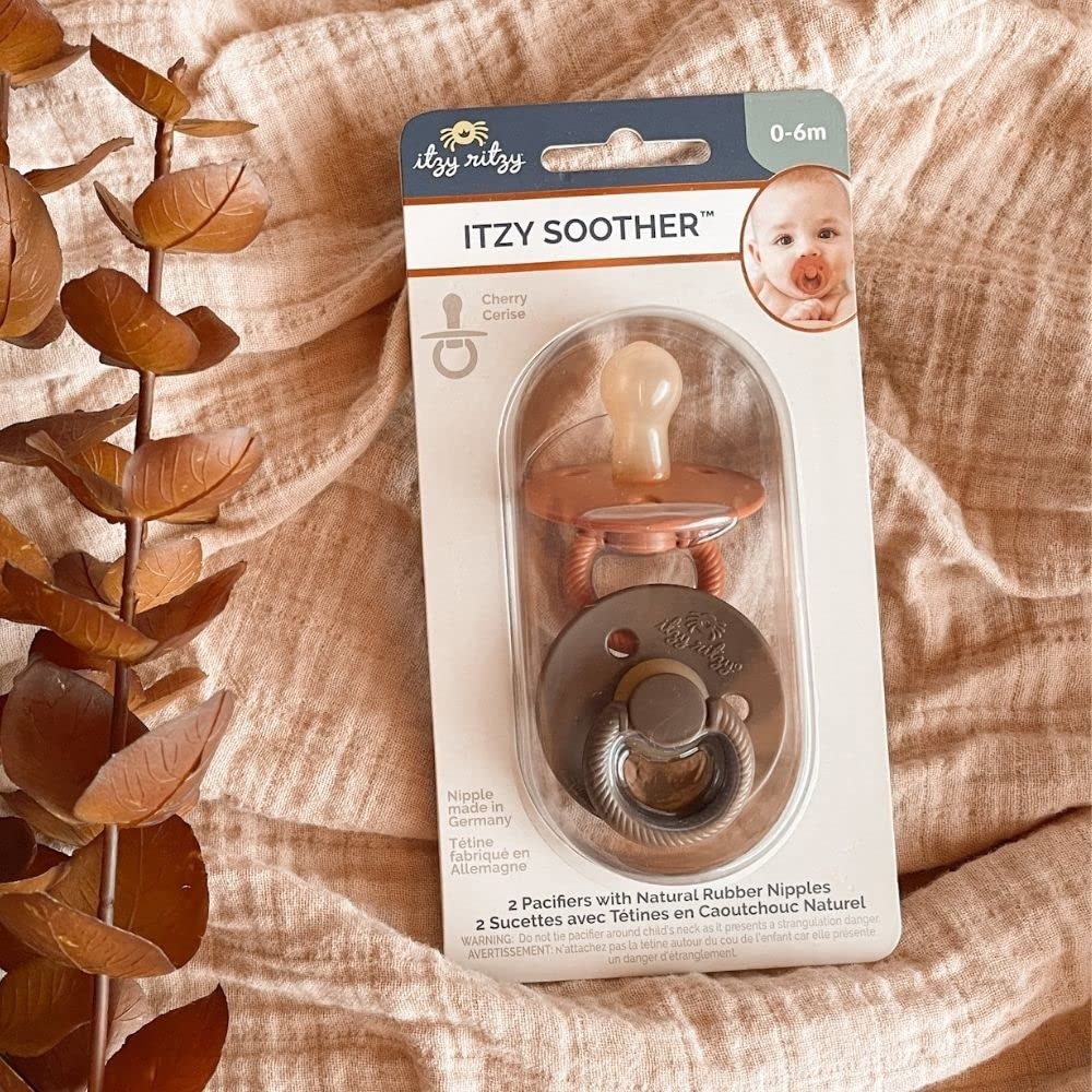 image:imageItzy Ritzy Natural Rubber Pacifiers Set of 2 Natural Rubber Newborn Pacifiers with CherryShaped Nipple amp Large Air Holes for Added Safety Set of 2 in Chocolate amp Caramel Ages 0 6 Months
